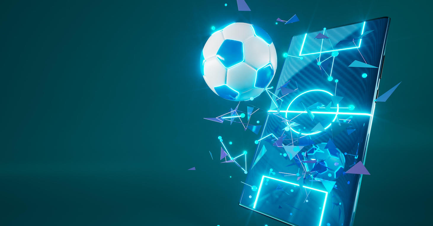 A football bursting through a shining mobile phone screen